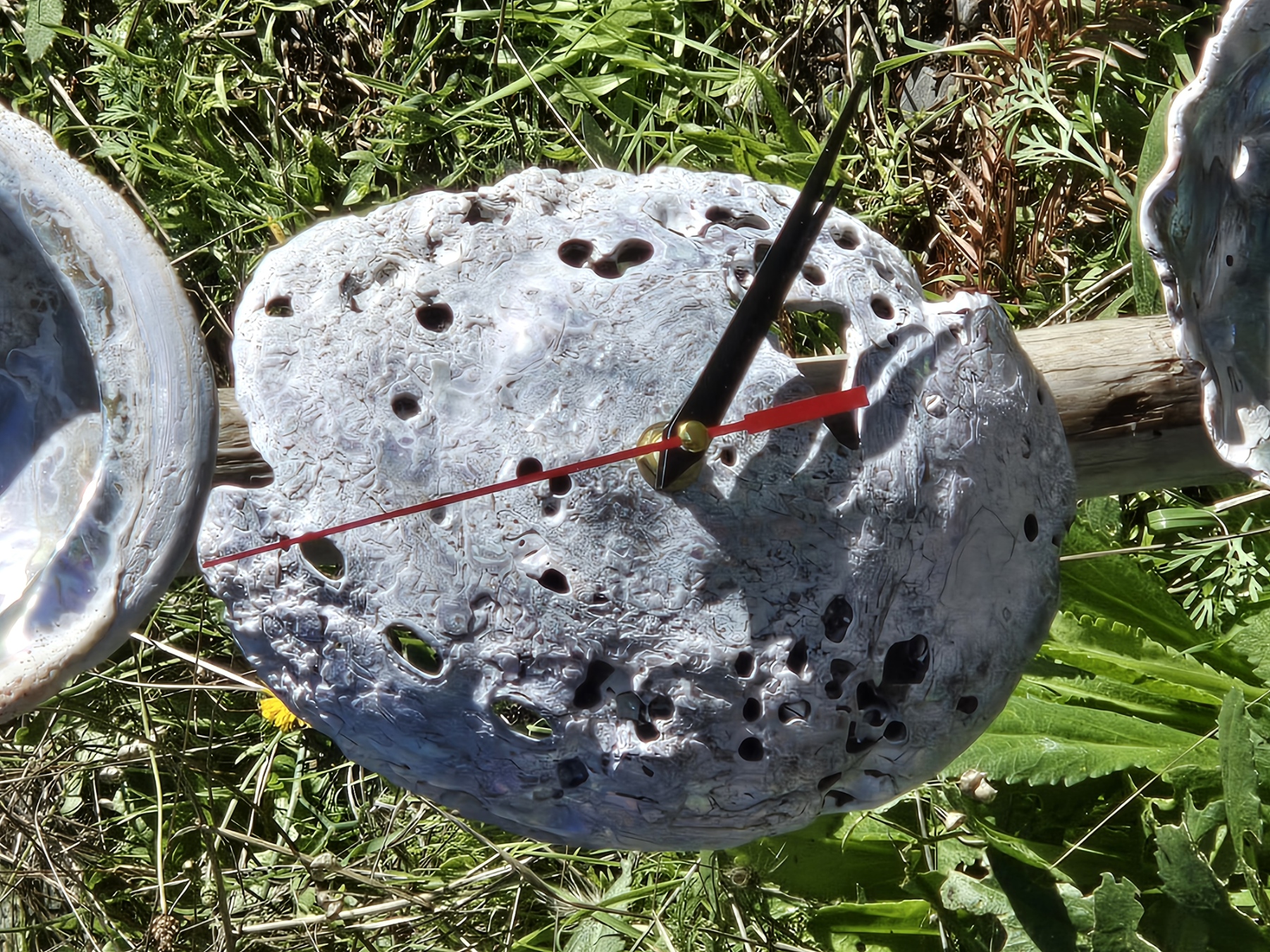 Flat abalone shell clock with red second hand